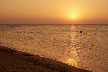 The sun rises over the Red Sea at dawn.