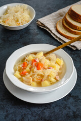 Sauerkraut soup with potatoes and carrots
