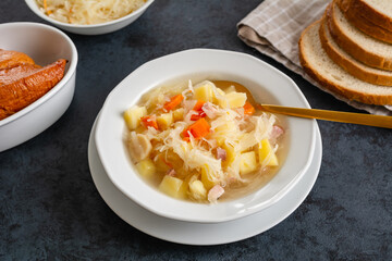 Sauerkraut soup with potatoes and carrots