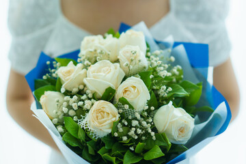 Happy Asian beautiful young woman holding a bouquet of flowers in wedding ceremony. 
