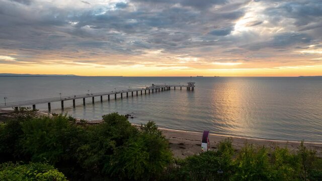 Time lapse video with colorful sunrise view of the bridge at the Black sea coast in Burgas, Bulgaria.