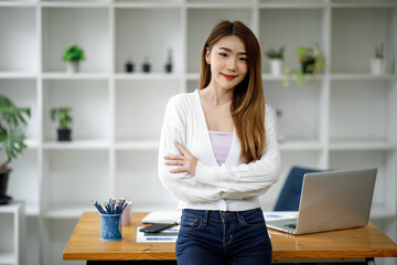 portrait of a businesswoman sitting at her workplace in the office, 