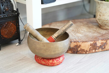 Tibetan singing bowl with sticks. concept of yoga and meditation