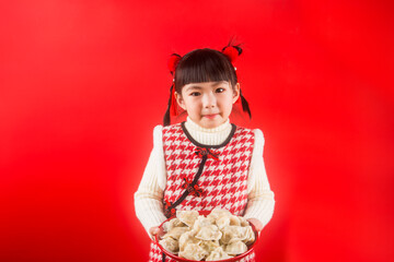 A Chinese girl is happy to welcome the Spring Festival