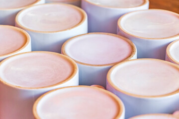 White coffee cups on wooden table tropical Holbox island Mexico.