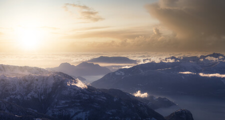 Aerial Panoramic View of Canadian Mountain covered in snow. Sunset Sky Art Render. Located near Squamish, North of Vancouver, British Columbia, Canada. Nature Background Panorama