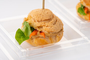one veggie profiterole with vegetables and lettuce. Catering. On a white background