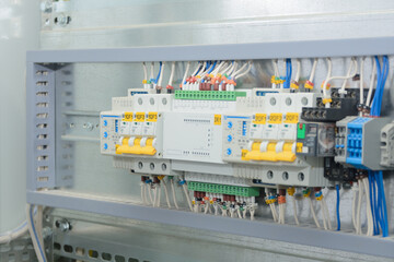 Programmable logic controller, automatic input of power reserve in the electrical cabinet. Close-up, selective focus