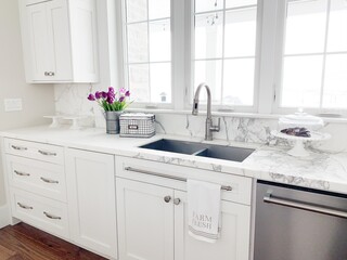 white marble kitchen sink with flowers
