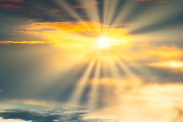 Fototapeta premium Sunset sky with dramatic clouds and sun shining through cloud. Holy heaven sky landscape