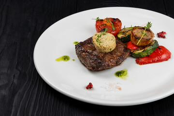 Grilled black angus strip loin steak with vegetables
