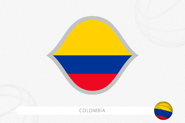 Colombia flag for basketball competition on gray basketball background.