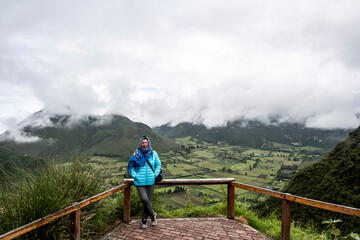 woman tourist on the background of a landscape with views of the islands of the Galapagos archipelago 