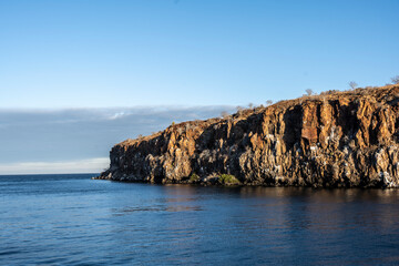 Fototapeta na wymiar uninhabited islands of the Galapagos archipelago against the backdrop of the sea and blue sky 