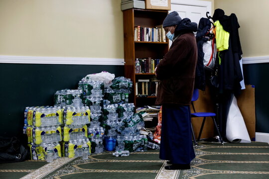 A man prays inside the Masjid Ar Rahmah mosque close to the multi-level apartment building fire in the Bronx borough of New York City