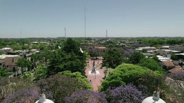Aerial view of the central square of Chascomus, a city located in the province of Buenos Aires, Argentina. Full of green trees and its immense lagoon.
