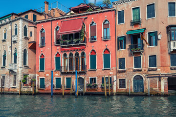 Fototapeta na wymiar Colorful facades of old medieval houses in Venice, Italy. View on Grand canal picturesque landscape. Retro vintage Instagram style filter effect.