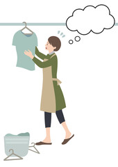 エプロンをして困った顔で洗濯物を干す女性（吹き出し付き・ワンオペ家事等のイメージに）