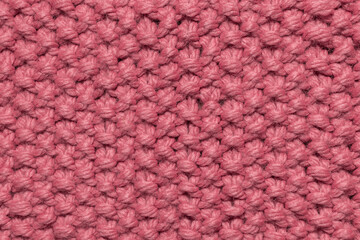 pink fabric created on knitting needles, "pearl knitting" pattern