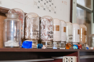 Glass flasks with chemical reagents in an old laboratory at the chemical faculty of the University.
