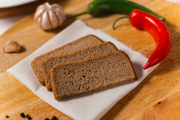pieces of rye bread on a wooden background
