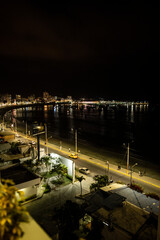 night landscape of seaside town promenade with beach 