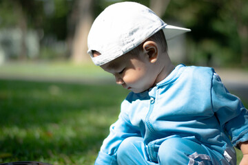 baby playing on the lawn