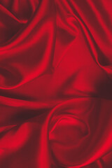 Obraz premium Red silk or satin luxury fabric texture can use as abstract background. Top view.
