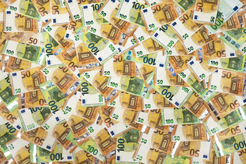 Euro banknotes, 50, 100 spread out in large size, perfect as background.