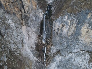 Aerial of the boka waterfall, highest waterfall in Slovenia in winter