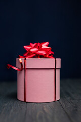 pink surprise gift box with red bow for birthday and happy valentine's day