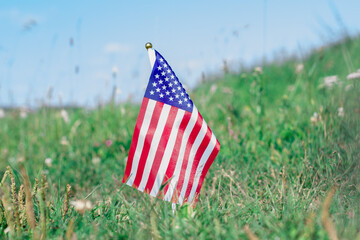 American flag on green grass. Memorial day US flags. Labor day concept. Happy Independence Day.