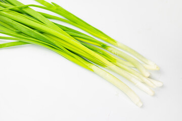 Obraz na płótnie Canvas bunch of green onions on white background