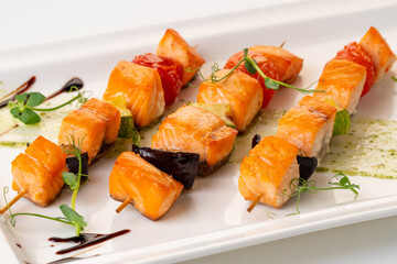 grilled salmon on a skewer with vegetables. Grilled seafood