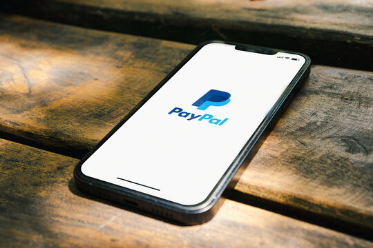 PayPal App On The Smartphone Screen On The Rustic Wooden Table In The Park. Top View. Rio De Janeiro, RJ, Brazil. January 2022