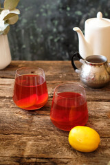 Tea with lemon. Wooden background, side view