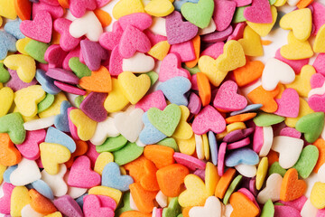 Multi-colored heart-shaped pastry topping sprinkles close-up minimalistic saint valentine`s day card