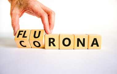 Covid-19 corona and flu flurona symbol. Doctor turns cubes and changes the word corona to flurona....