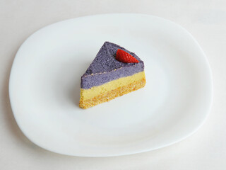 Raw vegan blueberry cake on a white background. Top view, copy space. Healthy food concept, dessert without baking.