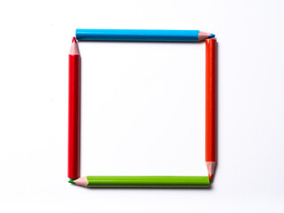 colored pencils forming a square isolated on a white background, geometric shapes on a white background