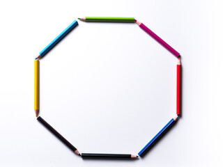 colored pencils forming a circle isolated on a white background, geometric shapes on a white background