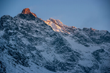 Rysy peak illuminated by the light of the setting sun. Tatra Mountains.