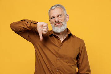 Irritated upset nervous displeased elderly gray-haired bearded man 40s years old wear brown shirt...