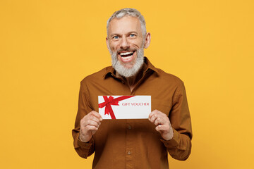 Happy joyful surprised shocked elderly gray-haired bearded man 40s years old wears brown shirthold...