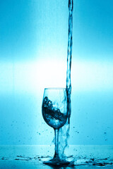 splash of water in a wine glass