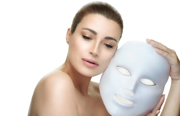 Beauty face spa woman with led mask. Photon therapy light treatment skin rejuvenation led facial...