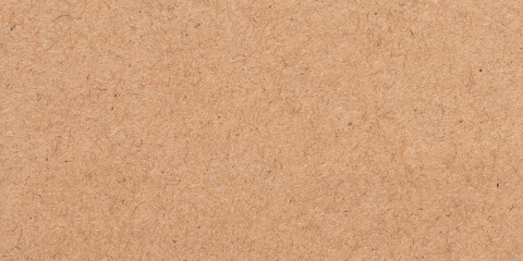 Fototapeta premium Light brown texture. Cardboard packaging. Beige parchment, manuscript. Rough background. Natural surface of a sheet of old paper.