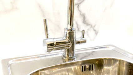 New faucet on the sink in the kitchen
