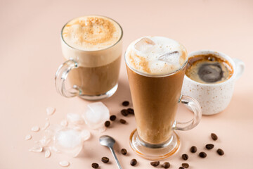 Ice coffee latte in glass cup, espresso cup and cappuccino. Various coffee drinks
