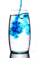 blue liquid splash in flower vase
